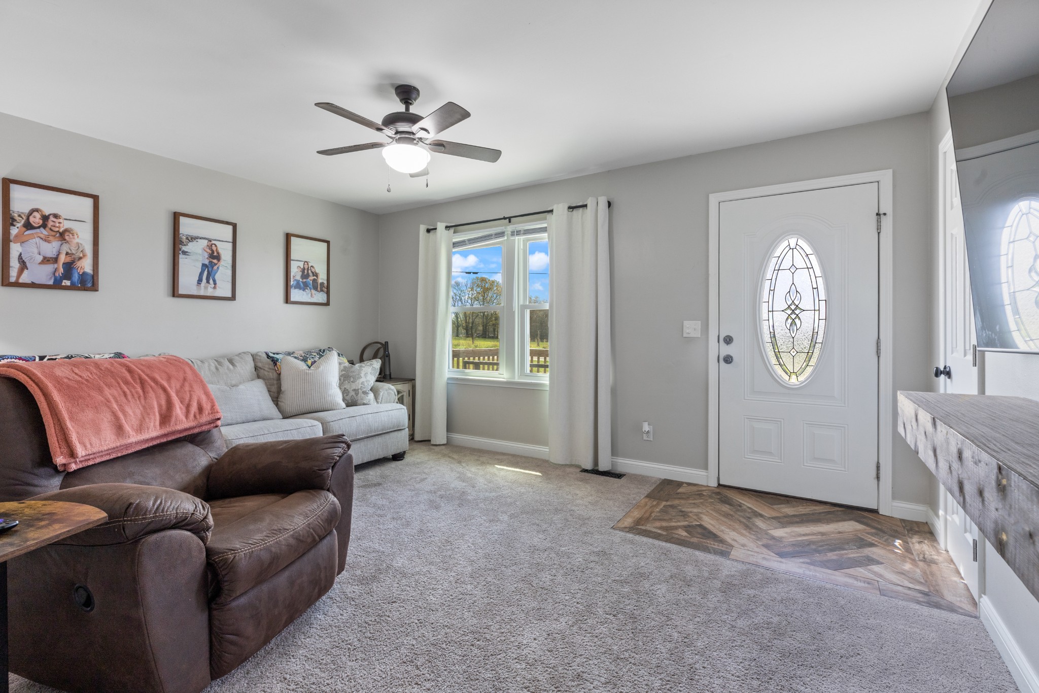 1230 Cooley Ford Road Tennessee Ridge, TN 37178 - Photo 8 of 30 a living room with furniture a clock and a window