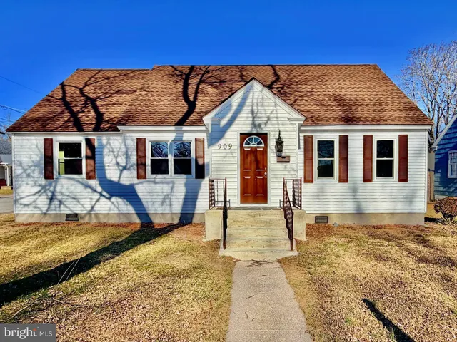 a view of a house with pool and sitting area