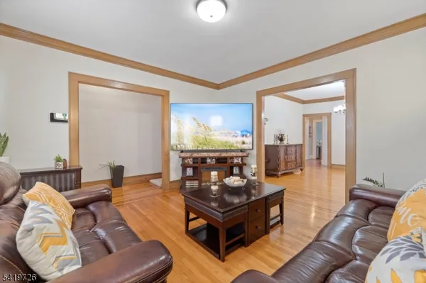 a living room with furniture and a lamp