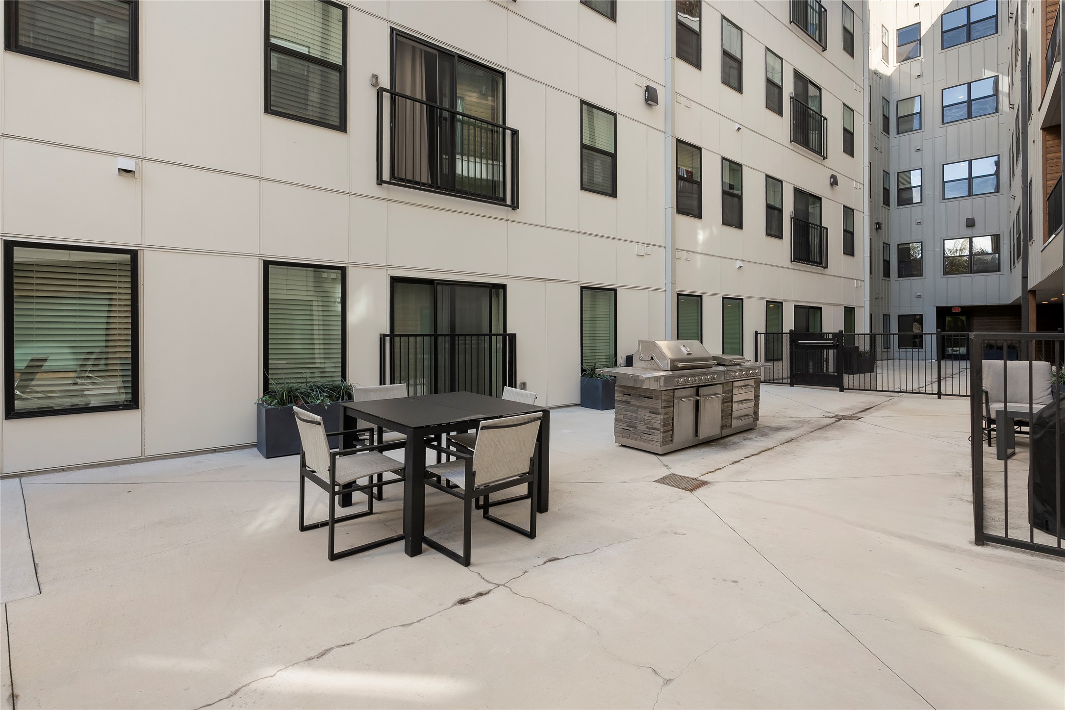 2500 Longview Street, Unit 400 Austin, TX 78705 - Photo 11 of 14 a view of a patio with dining table and chairs