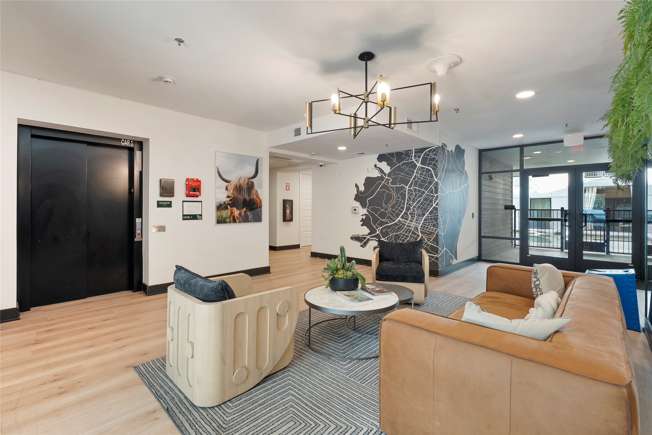 2500 Longview Street, Unit 400 Austin, TX 78705 - Photo 12 of 14 a living room with furniture a chandelier and a dining table
