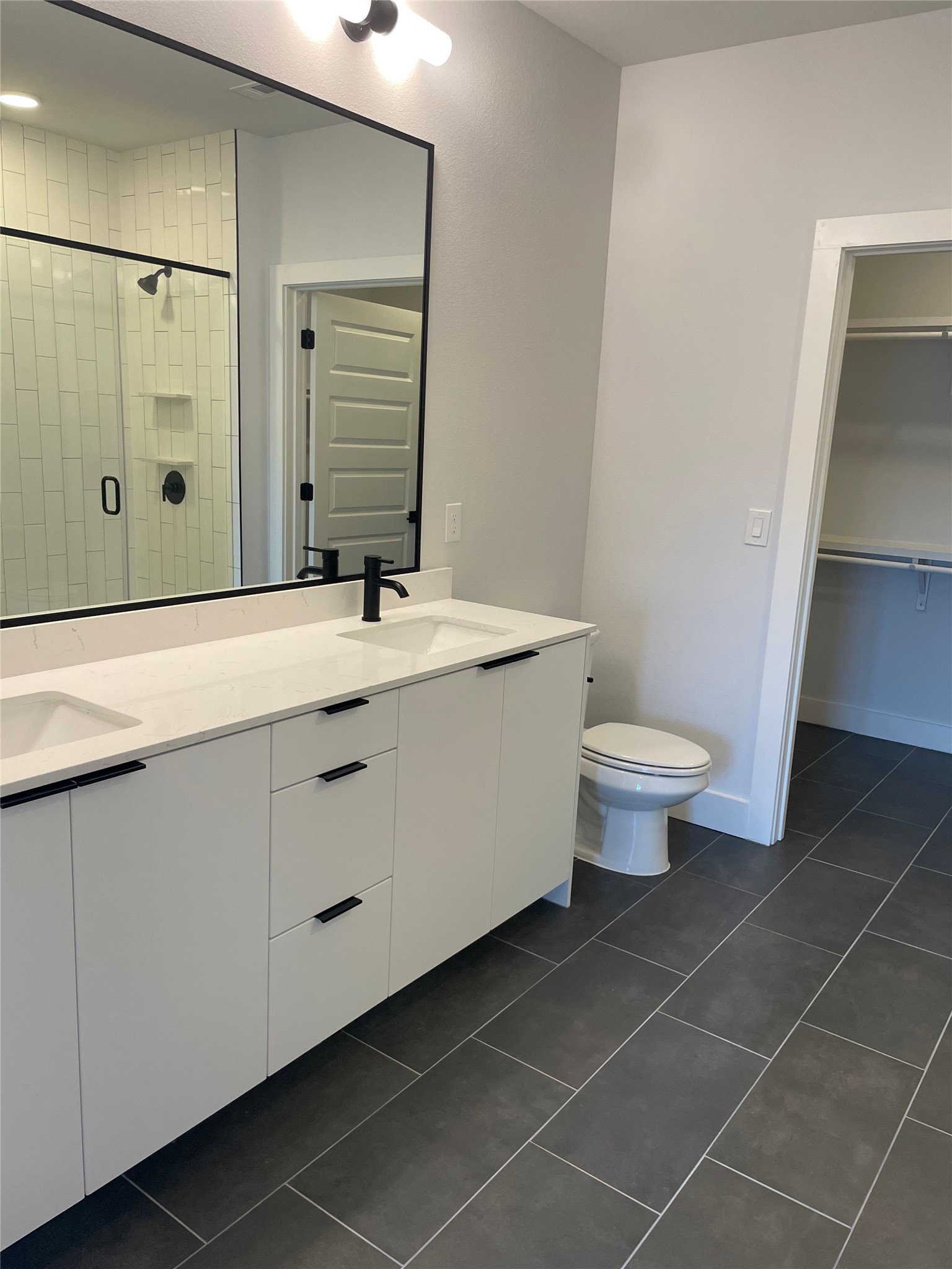 2500 Longview Street, Unit 400 Austin, TX 78705 - Photo 6 of 14 a bathroom with a sink a toilet and shower