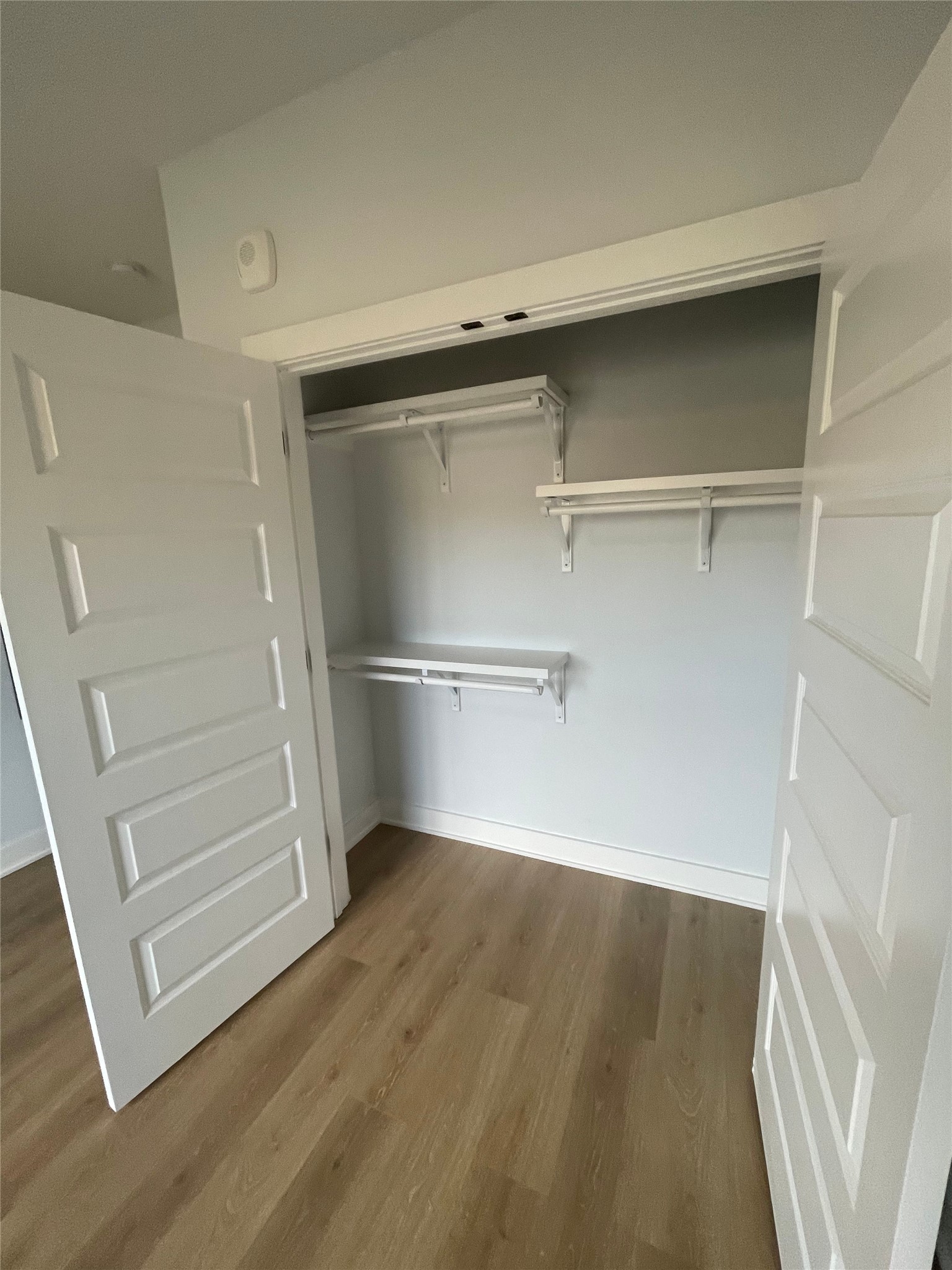 2500 Longview Street, Unit 400 Austin, TX 78705 - Photo 9 of 14 a view of walk in closet with empty racks