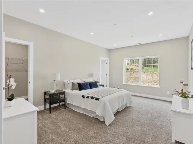 a bedroom with a bed and a table