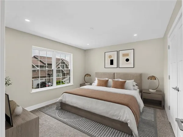 a bedroom with a bed and a large window