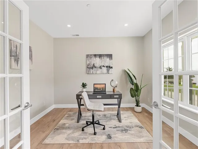 a workspace with furniture and a window