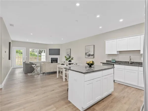 a kitchen with a sink and cabinets