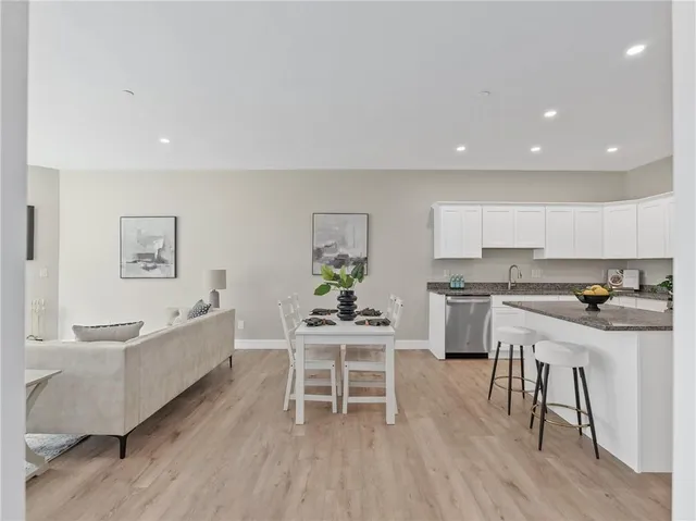 a kitchen with a table and chairs in it