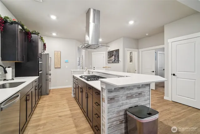 a kitchen with a stove and a refrigerator