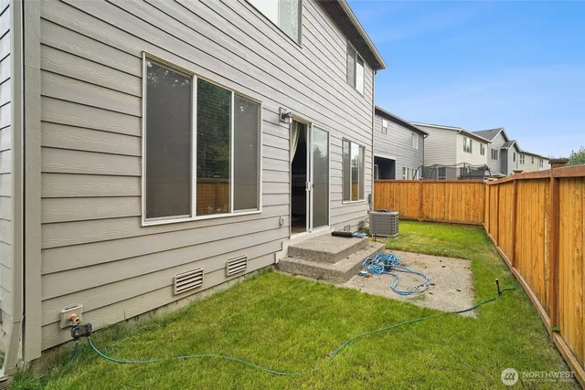 a view of backyard with cabin