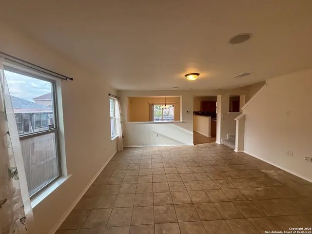 a view of empty room with windows