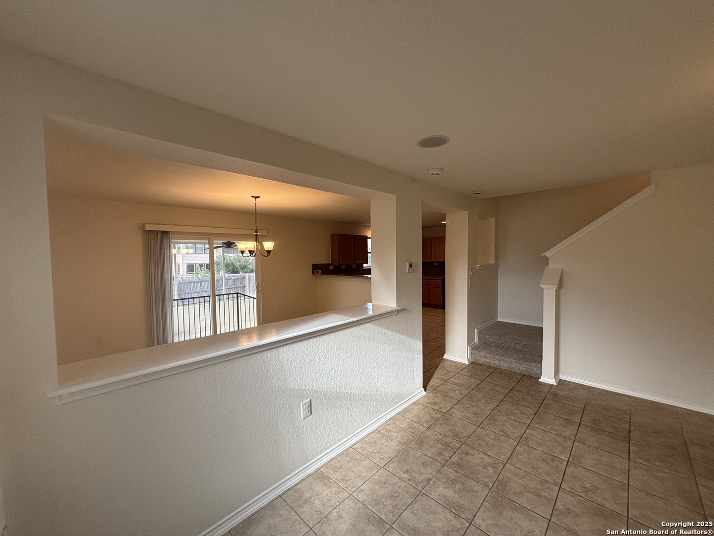 7370 Azalea Square San Antonio, TX 78218 - Photo 17 of 38 a view of a big room with windows and chandelier