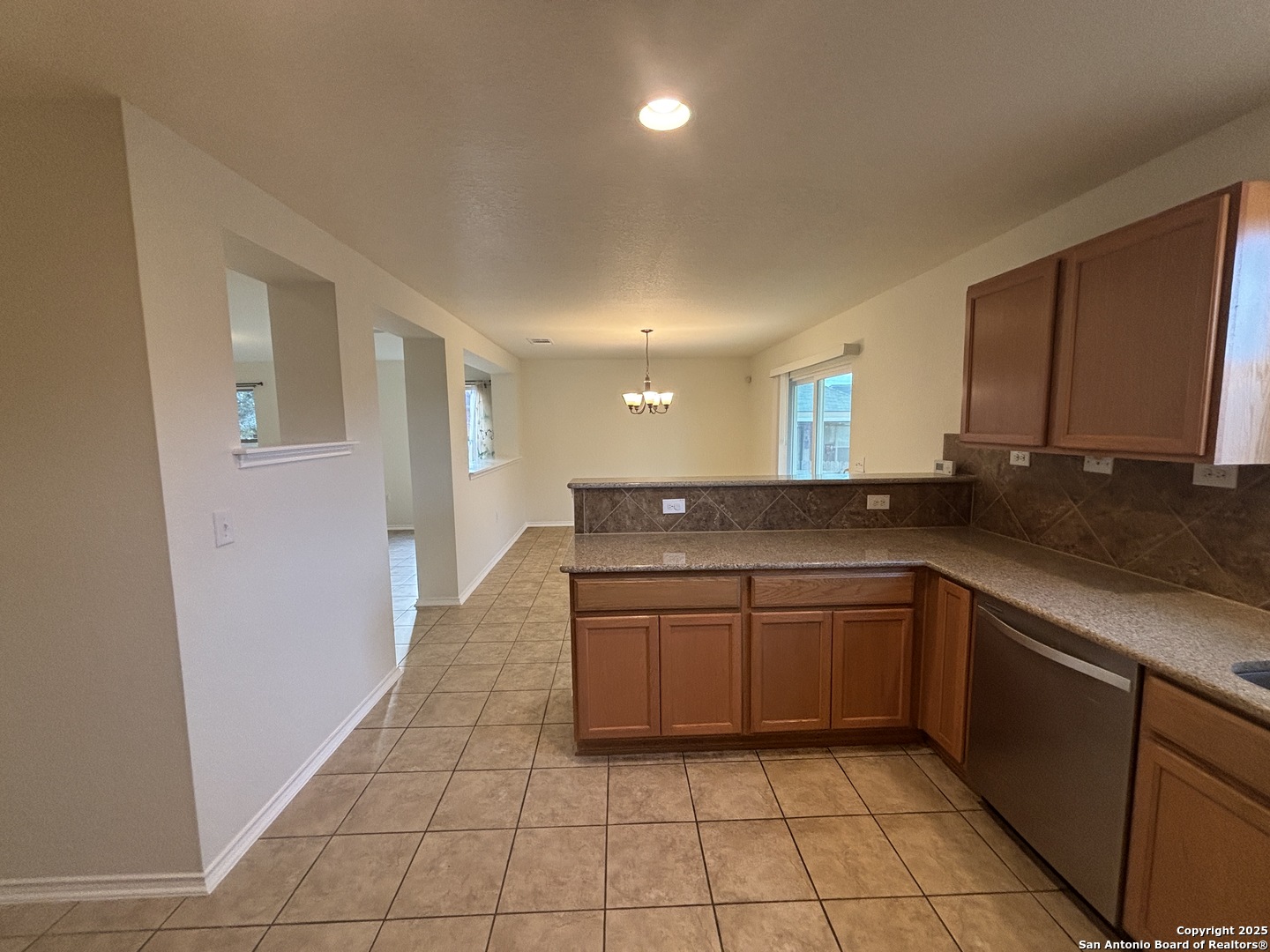 7370 Azalea Square San Antonio, TX 78218 - Photo 23 of 38 a kitchen with stainless steel appliances granite countertop a sink and cabinets