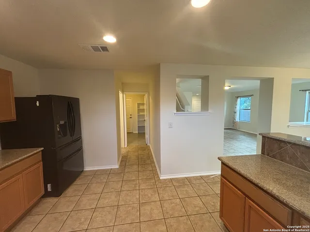 a view of a kitchen from the hallway