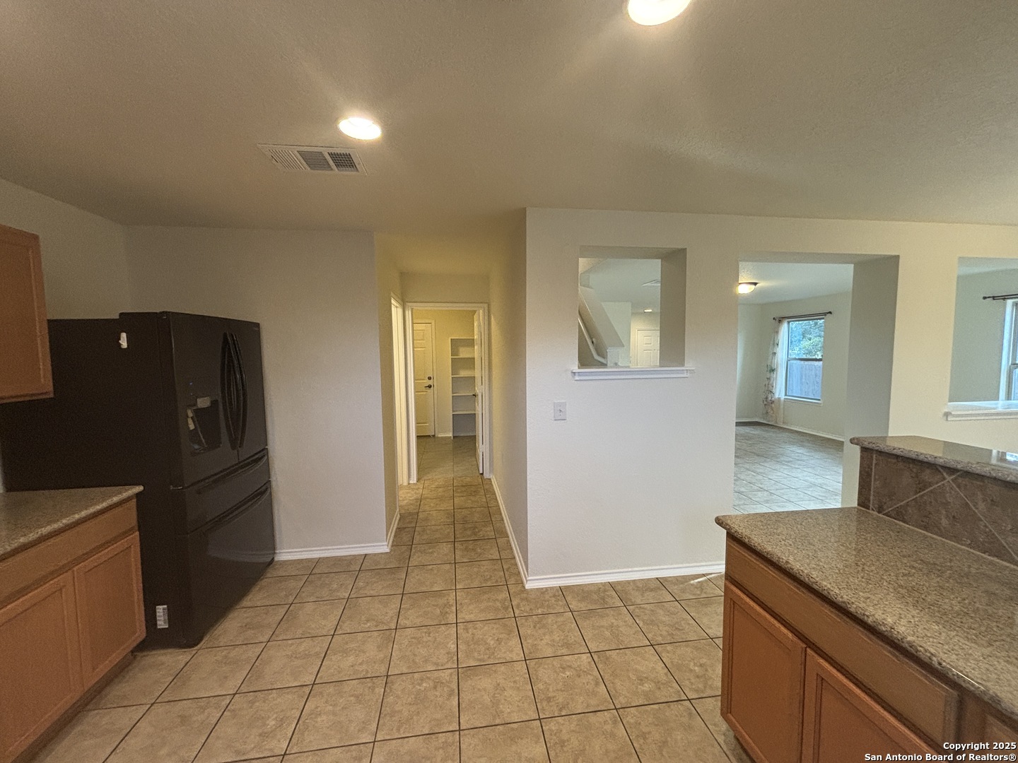 7370 Azalea Square San Antonio, TX 78218 - Photo 25 of 38 a view of a kitchen from the hallway