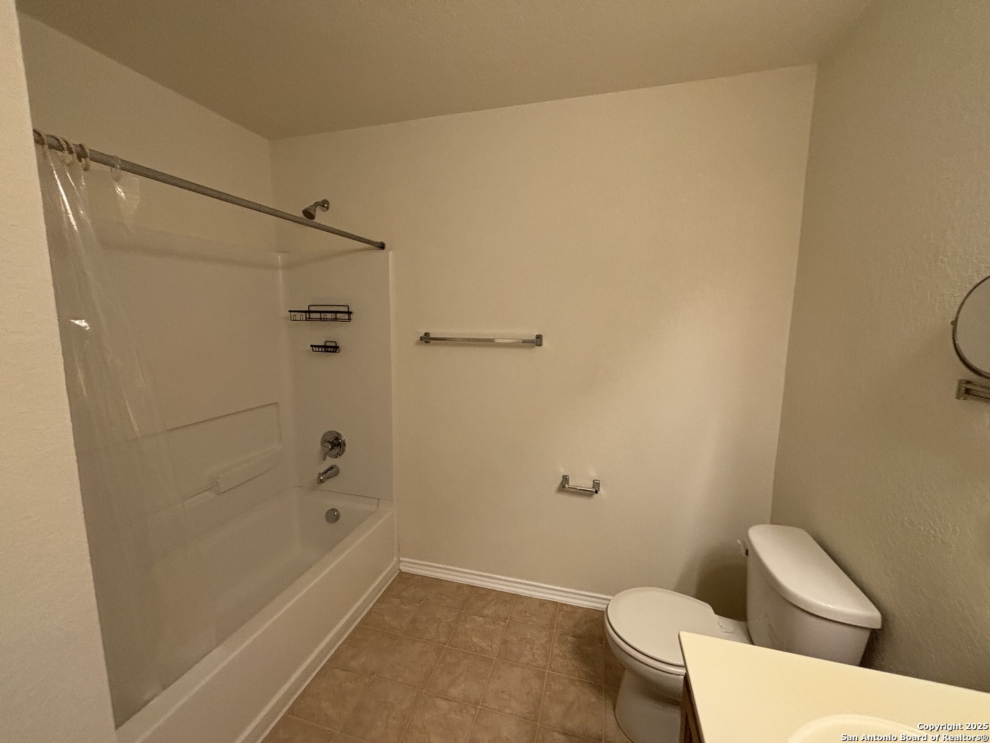7370 Azalea Square San Antonio, TX 78218 - Photo 29 of 38 a bathroom with a shower and a toilet