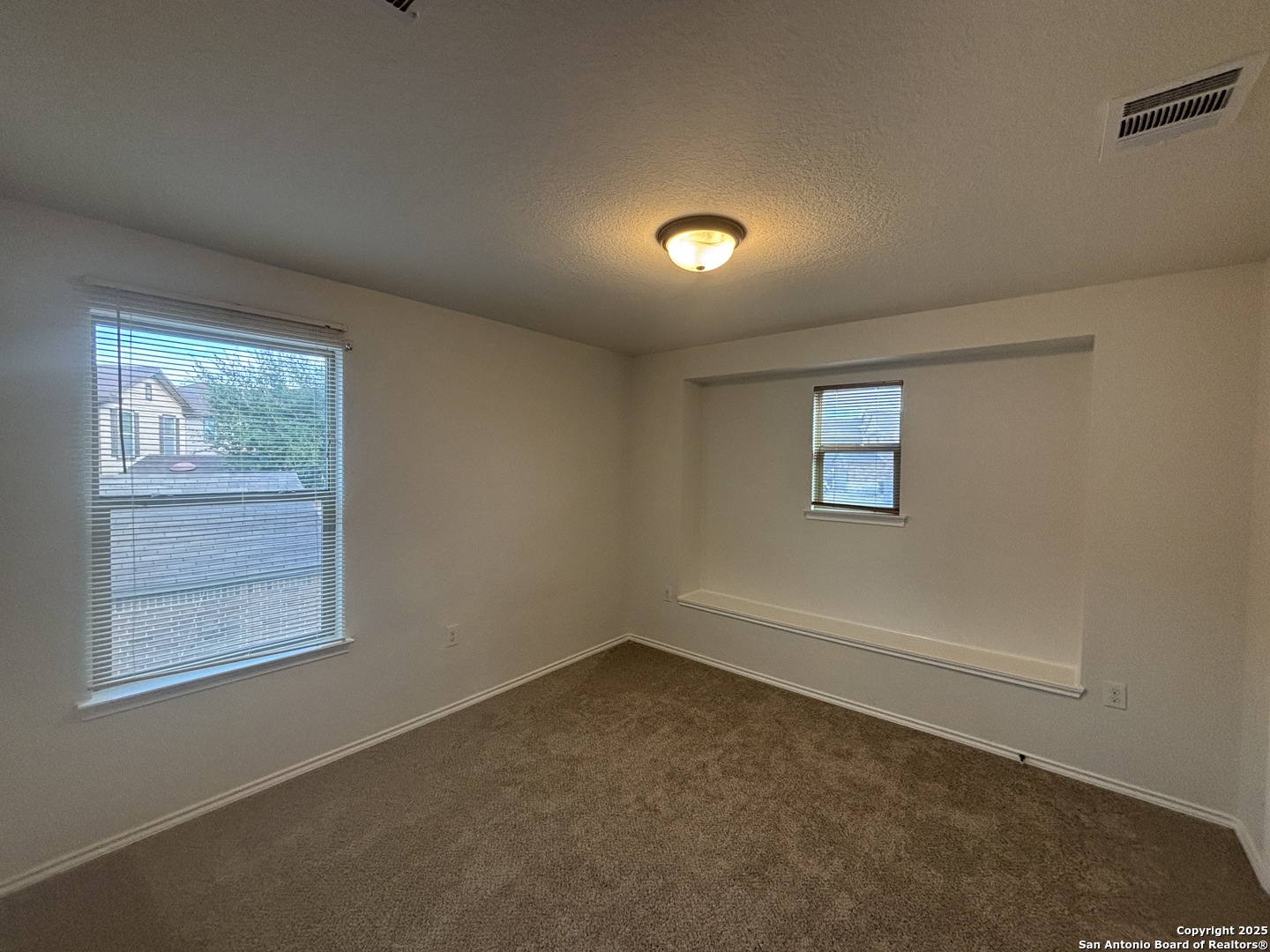 7370 Azalea Square San Antonio, TX 78218 - Photo 30 of 38 an empty room with windows