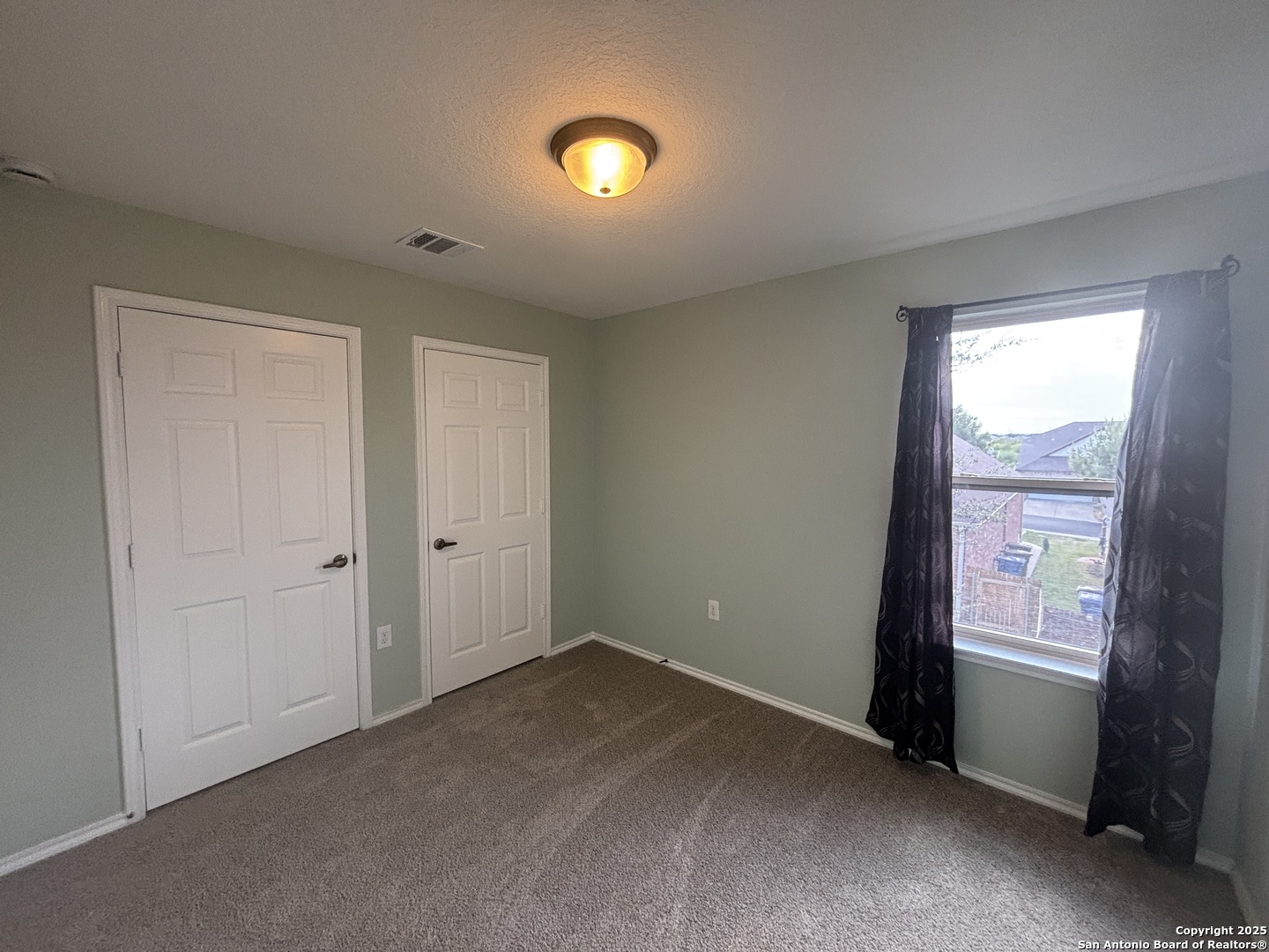 7370 Azalea Square San Antonio, TX 78218 - Photo 33 of 38 an empty room with windows and closet