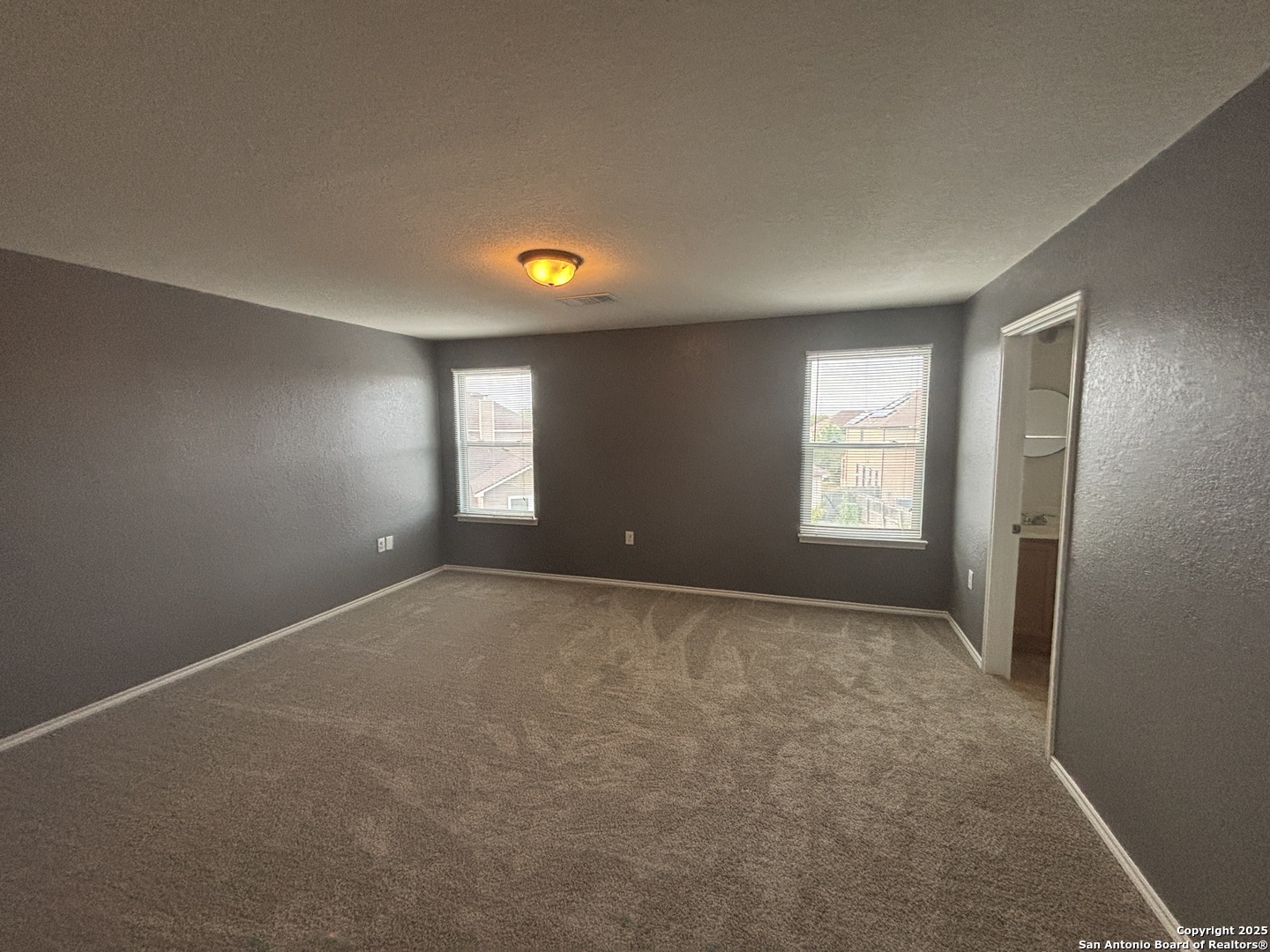 7370 Azalea Square San Antonio, TX 78218 - Photo 34 of 38 an empty room with windows and closet