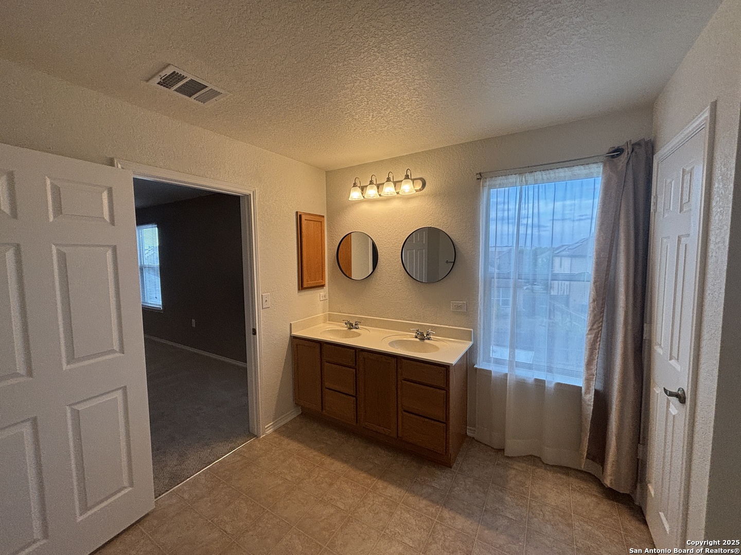 7370 Azalea Square San Antonio, TX 78218 - Photo 38 of 38 a kitchen with cabinets and window