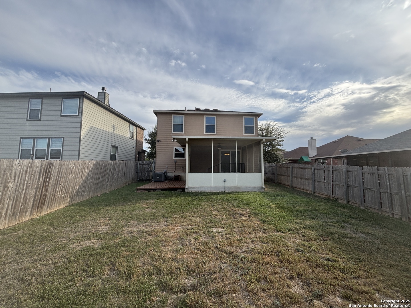 7370 Azalea Square San Antonio, TX 78218 - Photo 9 of 38 a view of a yard in front of a house with wooden fence