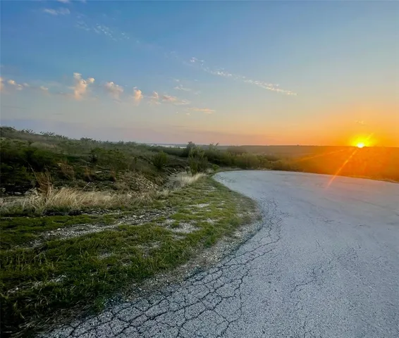 a view of a lake with a big yard