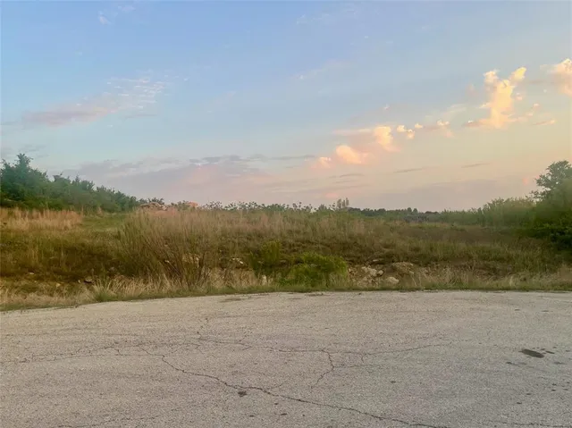 a view of lake with mountain in background