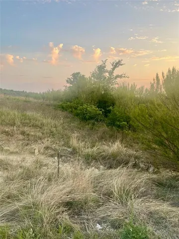 a view of a lake with houses in the back