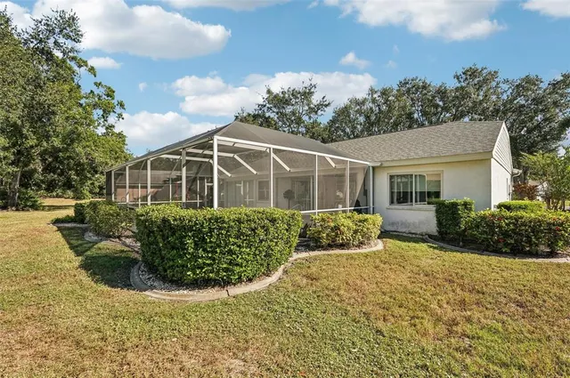 a front view of a house with yard and green space