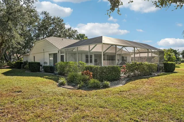 an aerial view of a house with a yard and a garden