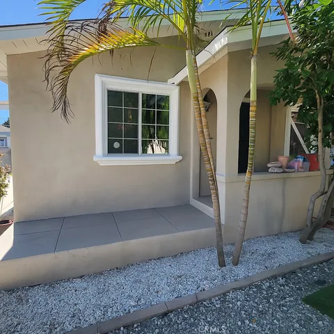 a front view of a house with parking area