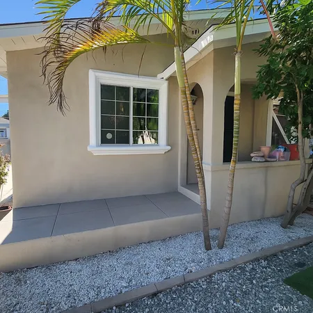 a front view of a house with parking area