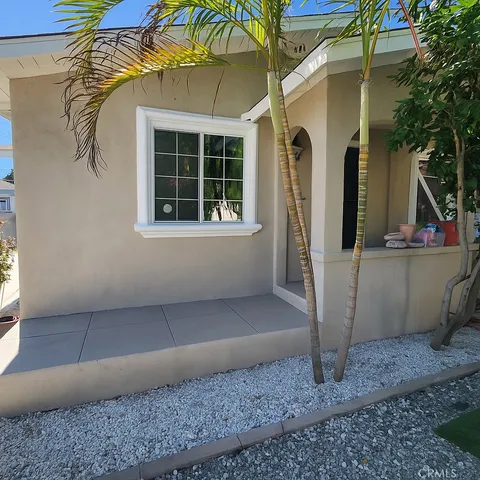 a front view of a house with parking area