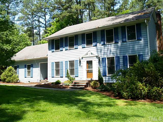 225 Carriage Trail Raleigh, NC 27614 - Photo 1 of 25 a front view of a house with a yard table and chairs