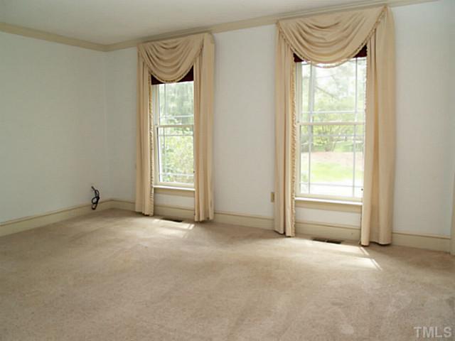 225 Carriage Trail Raleigh, NC 27614 - Photo 15 of 25 a view of an empty room with a window