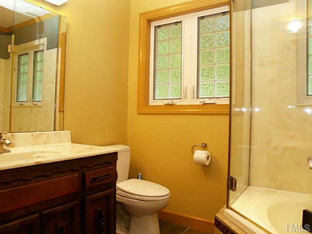 225 Carriage Trail Raleigh, NC 27614 - Photo 24 of 25 a bathroom with a sink and a toilet
