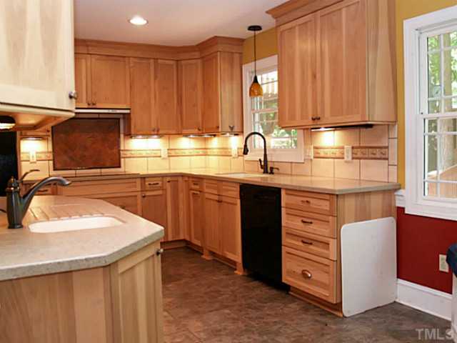 225 Carriage Trail Raleigh, NC 27614 - Photo 9 of 25 a kitchen with stainless steel appliances granite countertop a sink stove and cabinets