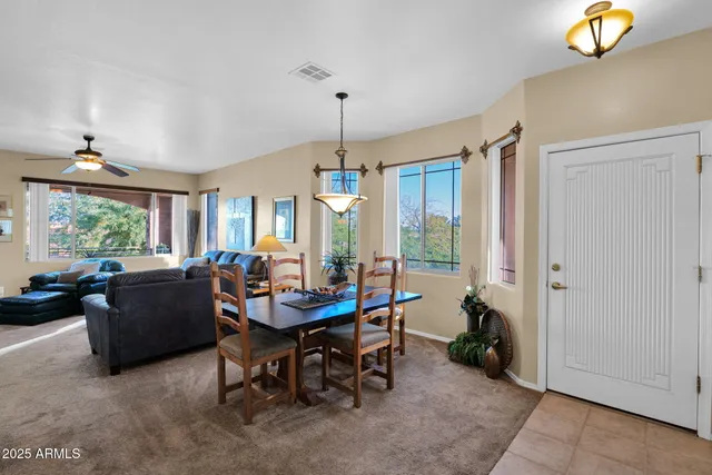 a dining room with furniture and window