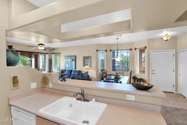 a kitchen with a sink cabinets and appliances