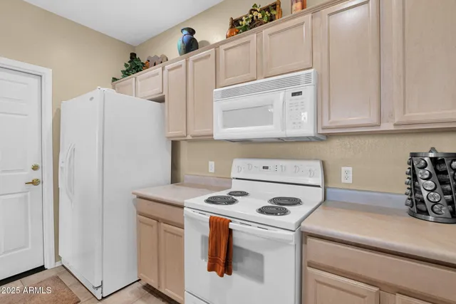 a living room with furniture a flat screen tv and a large window