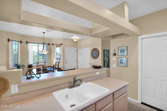 a bedroom with furniture and a chandelier
