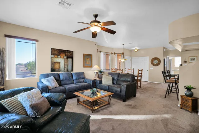 a spacious en suite bathroom with a large mirror and sink
