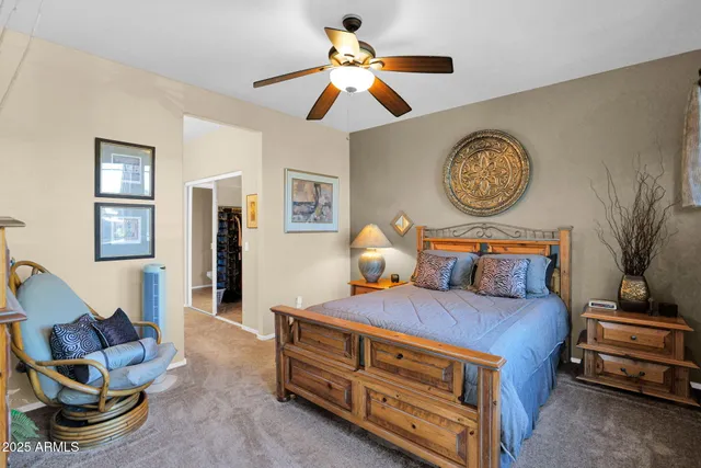 a bedroom with bed and a tv