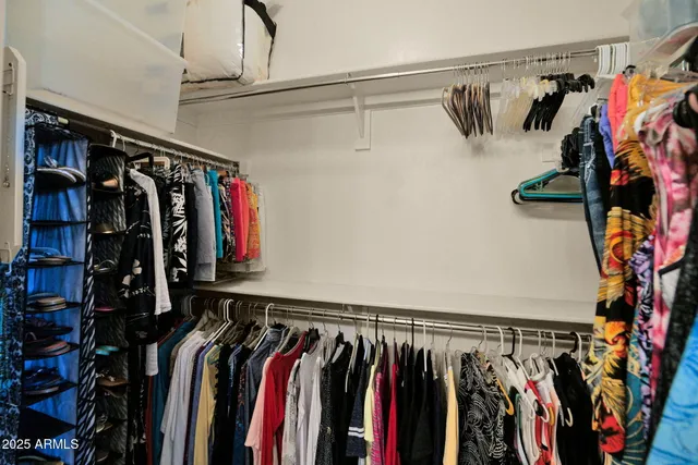 a view of a porch with furniture and a yard