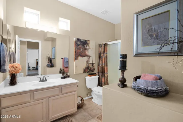 a living room with furniture a window and gym equipment