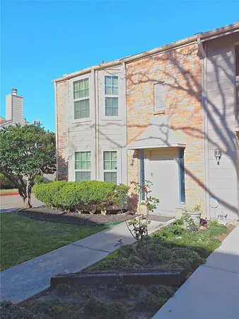 a kitchen with a stove a sink and cabinets