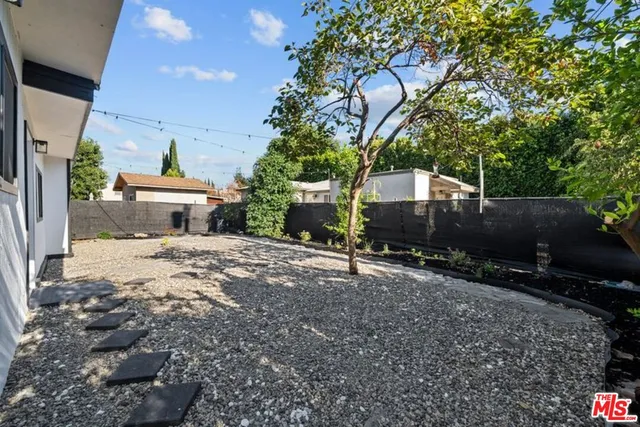 a view of backyard and deck