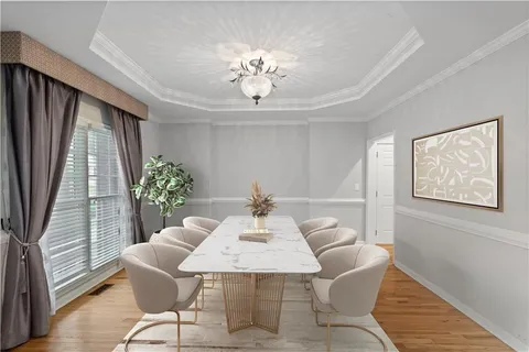 a view of a dining room with furniture and window