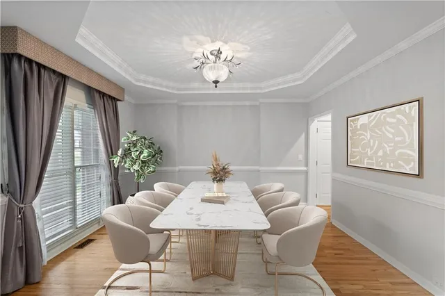 a view of a dining room with furniture and window