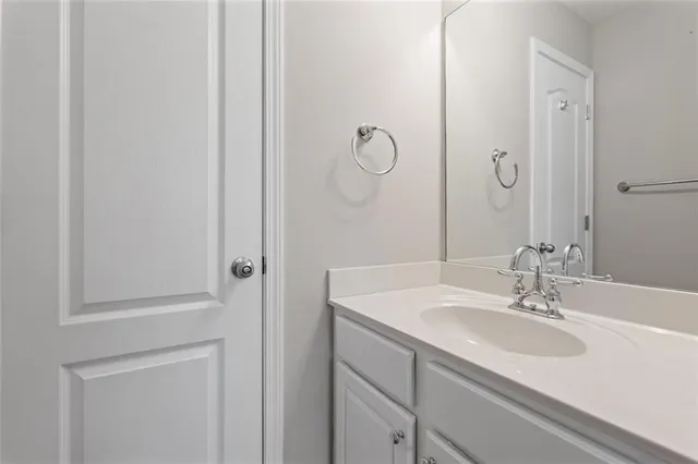 a bathroom with a sink and mirror